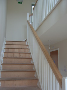 Solid maple hand rail and new stairs in new build property
