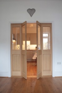 A pair of bi fold oak doors. These were fitted with a pair of parliament hinges enabling the doors to be folded all the way back to the wall for extra space.
